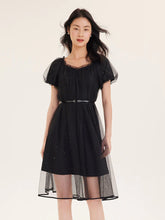 a woman in black short dress